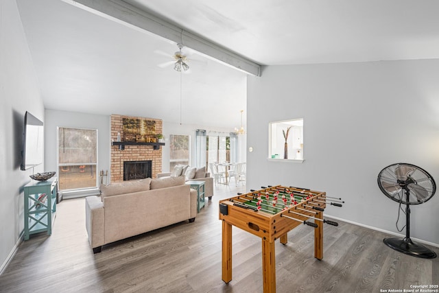 6718 Country Fld, San Antonio, TX 78240 - recreation room with ceiling fan, wood finished floors, a brick fireplace, and baseboards