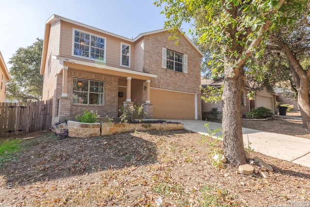 10819 Indigo, San Antonio, TX 78239 - view of front of house featuring a garage, brick siding, concrete driveway, and a porch