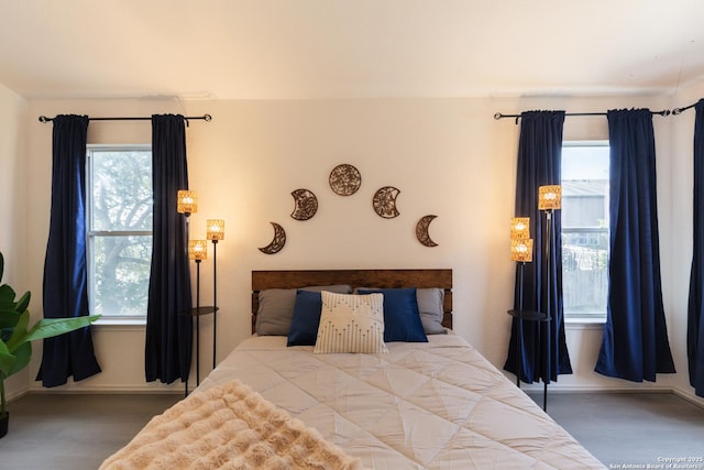 10819 Indigo, San Antonio, TX 78239 - bedroom with wood finished floors, multiple windows, and baseboards