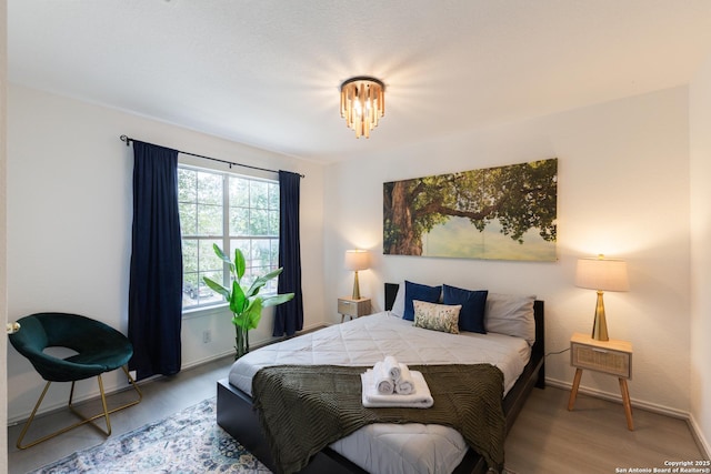 10819 Indigo, San Antonio, TX 78239 - bedroom with wood finished floors and baseboards