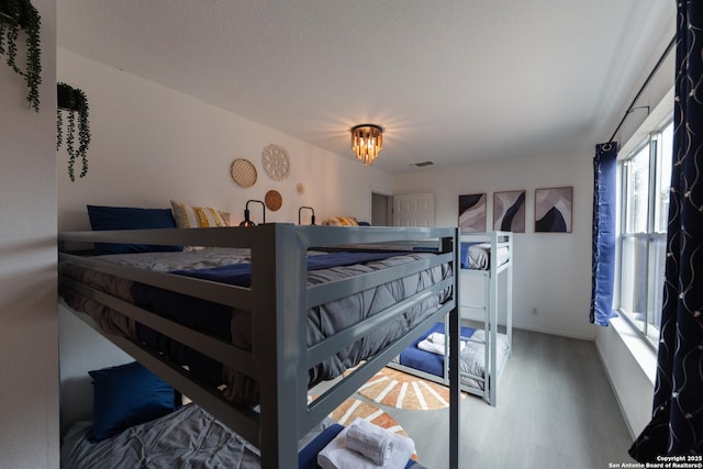 10819 Indigo, San Antonio, TX 78239 - bedroom with wood finished floors and baseboards