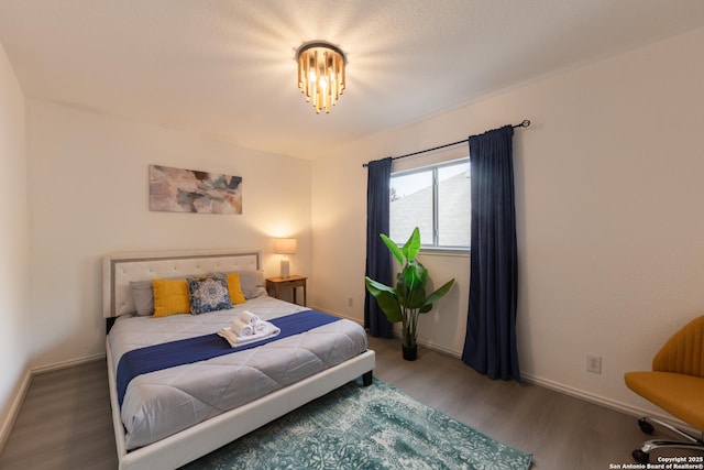 10819 Indigo, San Antonio, TX 78239 - bedroom featuring wood finished floors and baseboards