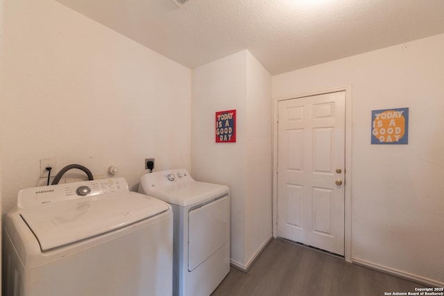10819 Indigo, San Antonio, TX 78239 - laundry area featuring dark wood-style flooring, washing machine and clothes dryer, and baseboards