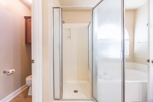 11610 Lemonmint, San Antonio, TX 78245 - full bath with a shower stall, toilet, a garden tub, and baseboards
