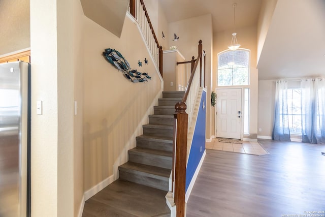 11610 Lemonmint, San Antonio, TX 78245 - entrance foyer featuring wood finished floors, stairway, a high ceiling, and baseboards