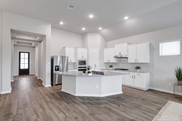 513 Foxbrook, Cibolo, TX 78108 - kitchen featuring appliances with stainless steel finishes, under cabinet range hood, a center island with sink, wood finished floors, and a sink