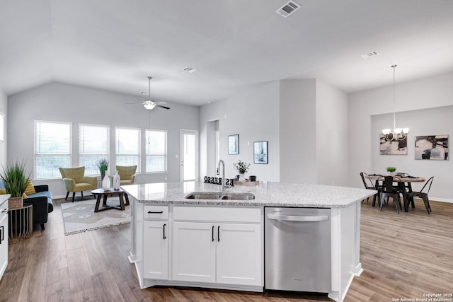 513 Foxbrook, Cibolo, TX 78108 - kitchen featuring dishwasher, a sink, light wood-style flooring, a chandelier, and light stone countertops