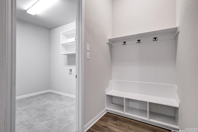 513 Foxbrook, Cibolo, TX 78108 - mudroom with baseboards and a textured ceiling