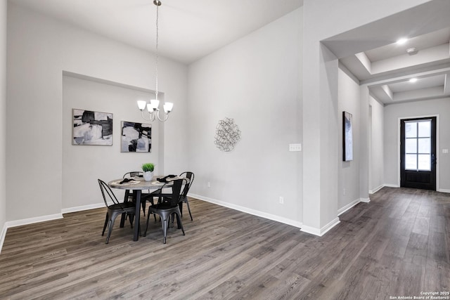 513 Foxbrook, Cibolo, TX 78108 - dining area featuring wood finished floors, baseboards, a chandelier, and a raised ceiling
