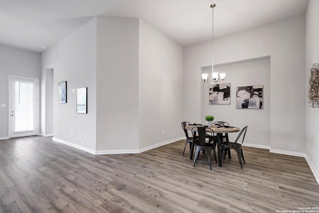 513 Foxbrook, Cibolo, TX 78108 - dining space with a chandelier, wood finished floors, and baseboards