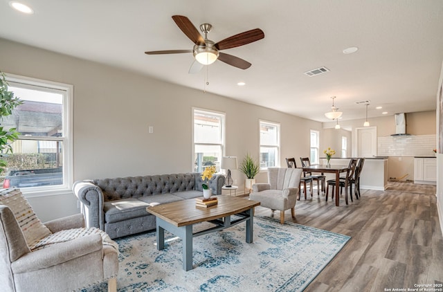 2411 W Huisache Ave, San Antonio, TX 78228 - living area featuring light wood-style flooring, baseboards, a ceiling fan, and recessed lighting