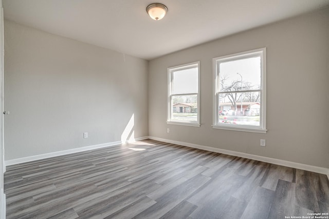 2411 W Huisache Ave, San Antonio, TX 78228 - unfurnished room featuring wood finished floors and baseboards