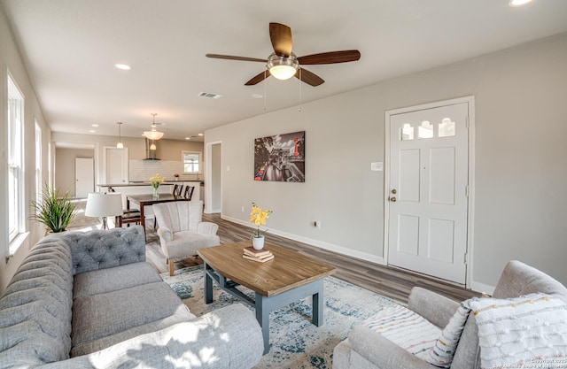 2411 W Huisache Ave, San Antonio, TX 78228 - living area with baseboards, wood finished floors, ceiling fan, and recessed lighting