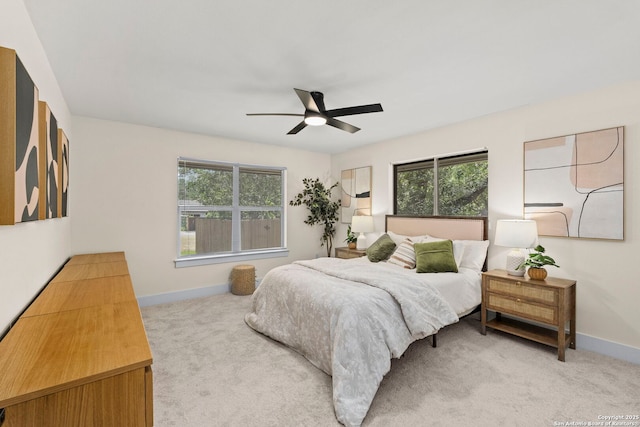 500 Skyforest, Hollywood Park, TX 78232 - bedroom with light carpet, baseboards, and a ceiling fan