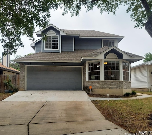 3730 Candlestone, San Antonio, TX 78244 - traditional-style home with driveway, roof with shingles, a garage, and brick siding
