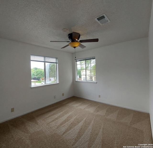 3730 Candlestone, San Antonio, TX 78244 - unfurnished room featuring a ceiling fan, light carpet, baseboards, and a textured ceiling