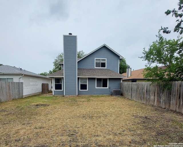 3730 Candlestone, San Antonio, TX 78244 - rear view of property featuring central AC, a chimney, and roof with shingles
