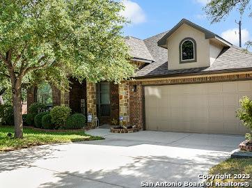 818 Grove Bnd, San Antonio, TX 78253 - view of front of house with driveway, a garage, and stucco siding