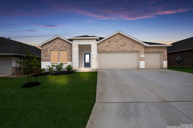 5957 Cerulean, Bulverde, TX 78163 - view of front facade with an attached garage, driveway, a front lawn, brick siding, and stone siding