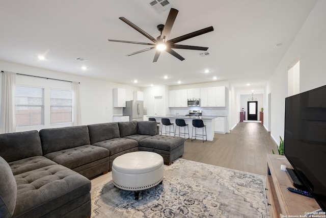 5957 Cerulean, Bulverde, TX 78163 - living room with ceiling fan, light wood-style flooring, and recessed lighting