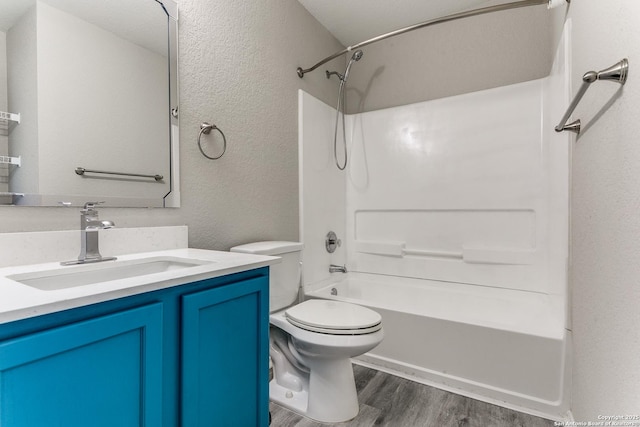 16311 Kentucky Rdg, Selma, TX 78154 - full bath with wood finished floors, a textured wall, toilet, vanity, and shower / bathtub combination