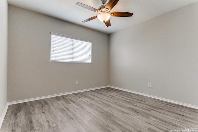 16311 Kentucky Rdg, Selma, TX 78154 - empty room with wood finished floors, a ceiling fan, and baseboards