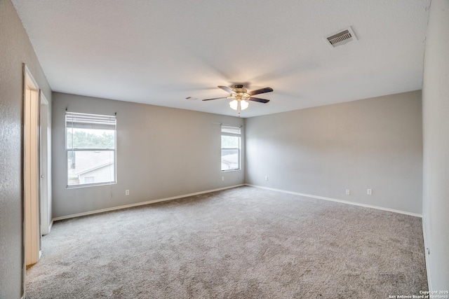 9843 Barhill Bay, San Antonio, TX 78245 - empty room featuring carpet flooring, a ceiling fan, and baseboards