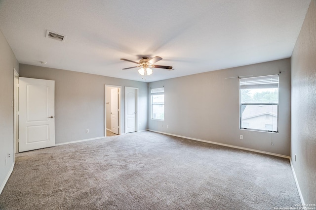 9843 Barhill Bay, San Antonio, TX 78245 - unfurnished bedroom featuring carpet, baseboards, and ceiling fan