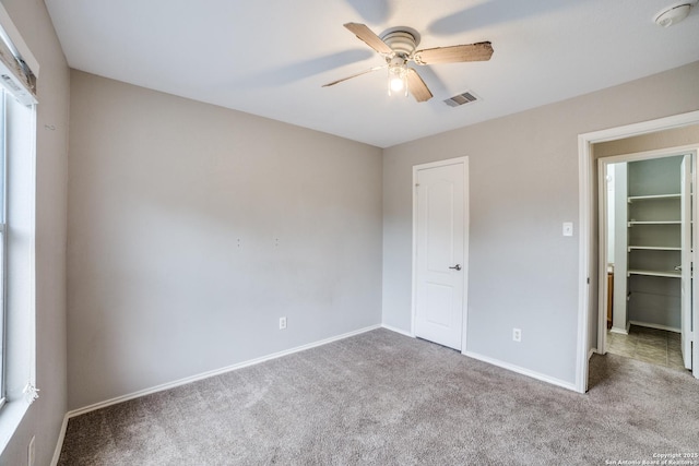 9843 Barhill Bay, San Antonio, TX 78245 - unfurnished bedroom with carpet floors, ceiling fan, and baseboards
