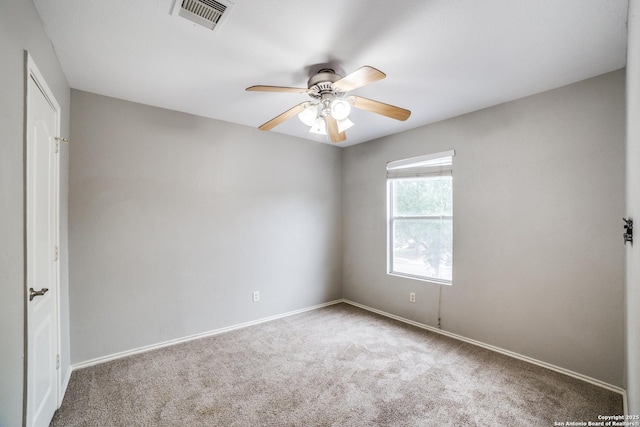 9843 Barhill Bay, San Antonio, TX 78245 - spare room featuring carpet flooring, a ceiling fan, and baseboards