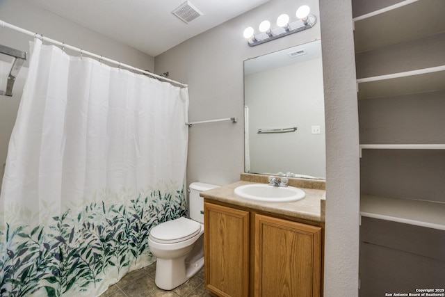9843 Barhill Bay, San Antonio, TX 78245 - full bathroom featuring toilet, vanity, tile patterned floors, and curtained shower
