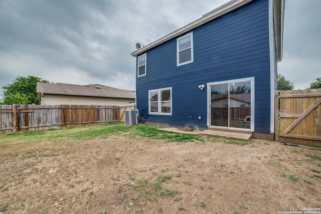 9843 Barhill Bay, San Antonio, TX 78245 - back of house featuring central AC unit and a fenced backyard