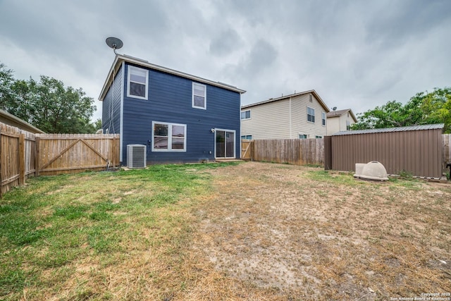 9843 Barhill Bay, San Antonio, TX 78245 - rear view of house featuring central air condition unit and a gate