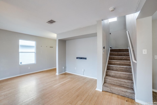9843 Barhill Bay, San Antonio, TX 78245 - stairs featuring wood finished floors and baseboards