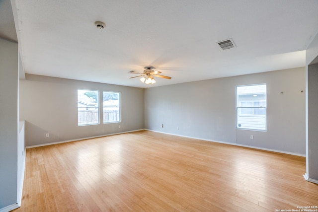 9843 Barhill Bay, San Antonio, TX 78245 - unfurnished room with ceiling fan, light wood-style floors, and baseboards