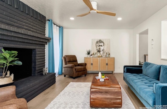 3719 Summer Breeze, San Antonio, TX 78253 - living room with ceiling fan, wood finished floors, recessed lighting, and a brick fireplace