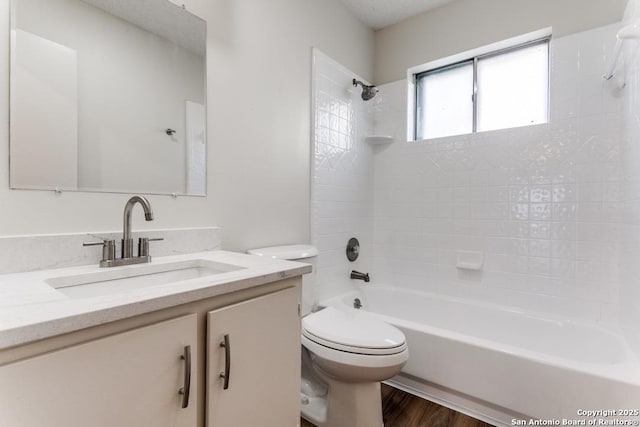 6419 Ridge Tree, San Antonio, TX 78233 - full bathroom with toilet, vanity, bathing tub / shower combination, and wood finished floors