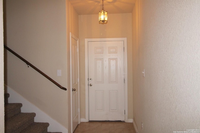 9118 Hogarten, Converse, TX 78109 - doorway to outside with stairs, light tile patterned floors, and baseboards