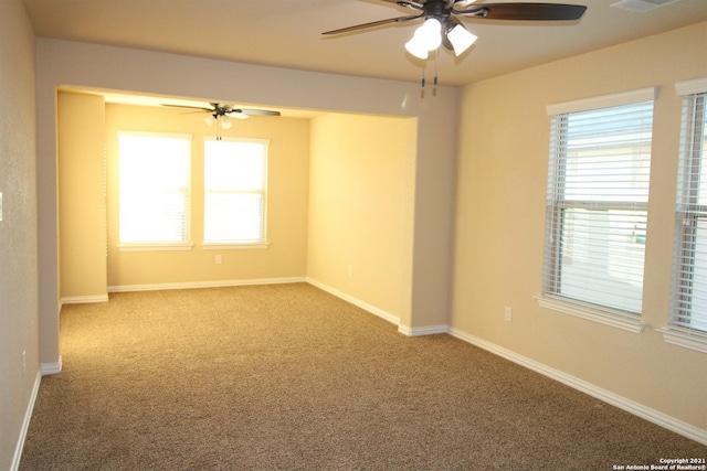 9118 Hogarten, Converse, TX 78109 - empty room featuring ceiling fan, carpet flooring, and baseboards