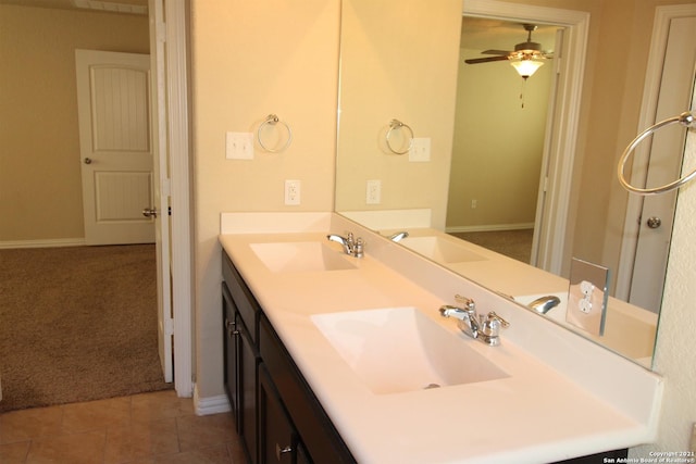9118 Hogarten, Converse, TX 78109 - full bathroom featuring baseboards, double vanity, a ceiling fan, and tile patterned flooring