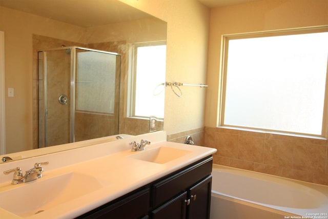 9118 Hogarten, Converse, TX 78109 - full bath featuring a stall shower, a bath, and double vanity