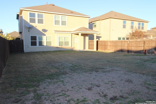 9118 Hogarten, Converse, TX 78109 - rear view of house with a fenced backyard