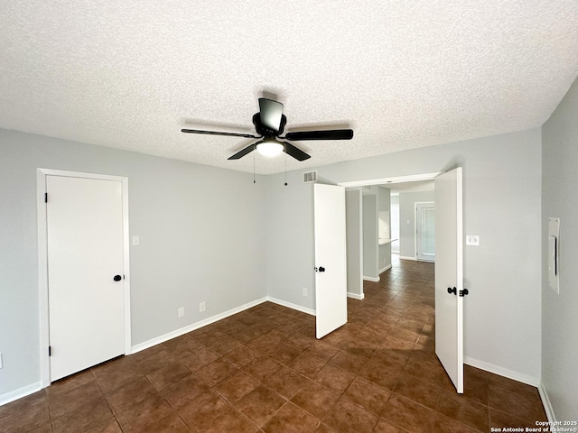11311 Sir Winston Unit 607, San Antonio, TX 78216 - tiled empty room with a textured ceiling, ceiling fan, and baseboards