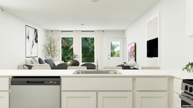3409 Hilts Trl, New Braunfels, TX 78130 - kitchen with dishwashing machine, a sink, light countertops, and white cabinetry