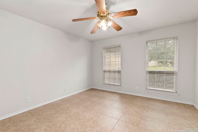 15311 Spring Rock, San Antonio, TX 78247 - spare room featuring ceiling fan, baseboards, and light tile patterned floors