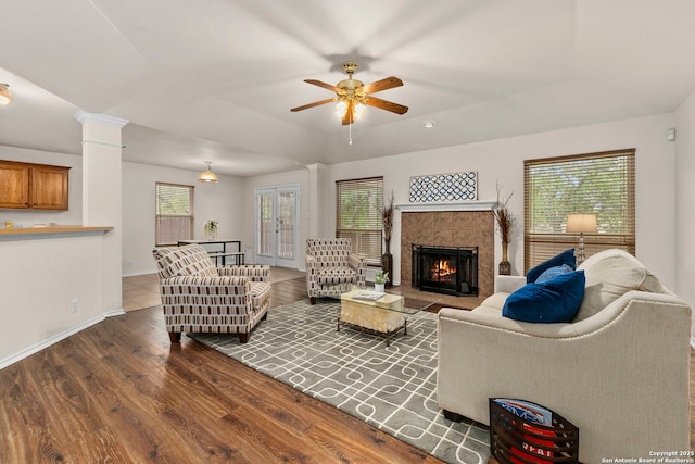 15311 Spring Rock, San Antonio, TX 78247 - living area with ceiling fan, wood finished floors, baseboards, a fireplace, and decorative columns