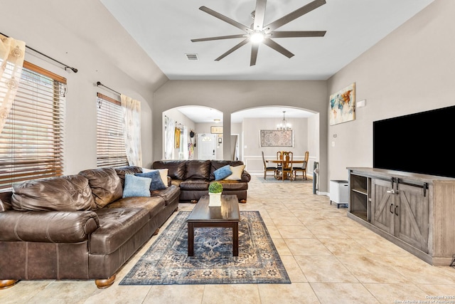 21742 Thunder Basin, San Antonio, TX 78261 - living room with arched walkways, ceiling fan, light tile patterned floors, baseboards, and a chandelier