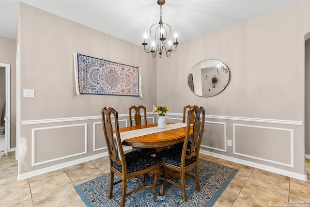 21742 Thunder Basin, San Antonio, TX 78261 - dining area featuring a decorative wall, a chandelier, tile patterned floors, and wainscoting