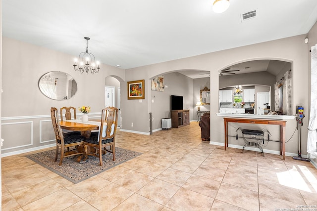 21742 Thunder Basin, San Antonio, TX 78261 - dining room featuring arched walkways, light tile patterned flooring, and a chandelier