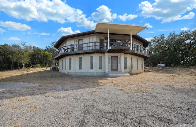 8060 Prue, San Antonio, TX 78249 - back of property with a balcony and cooling unit